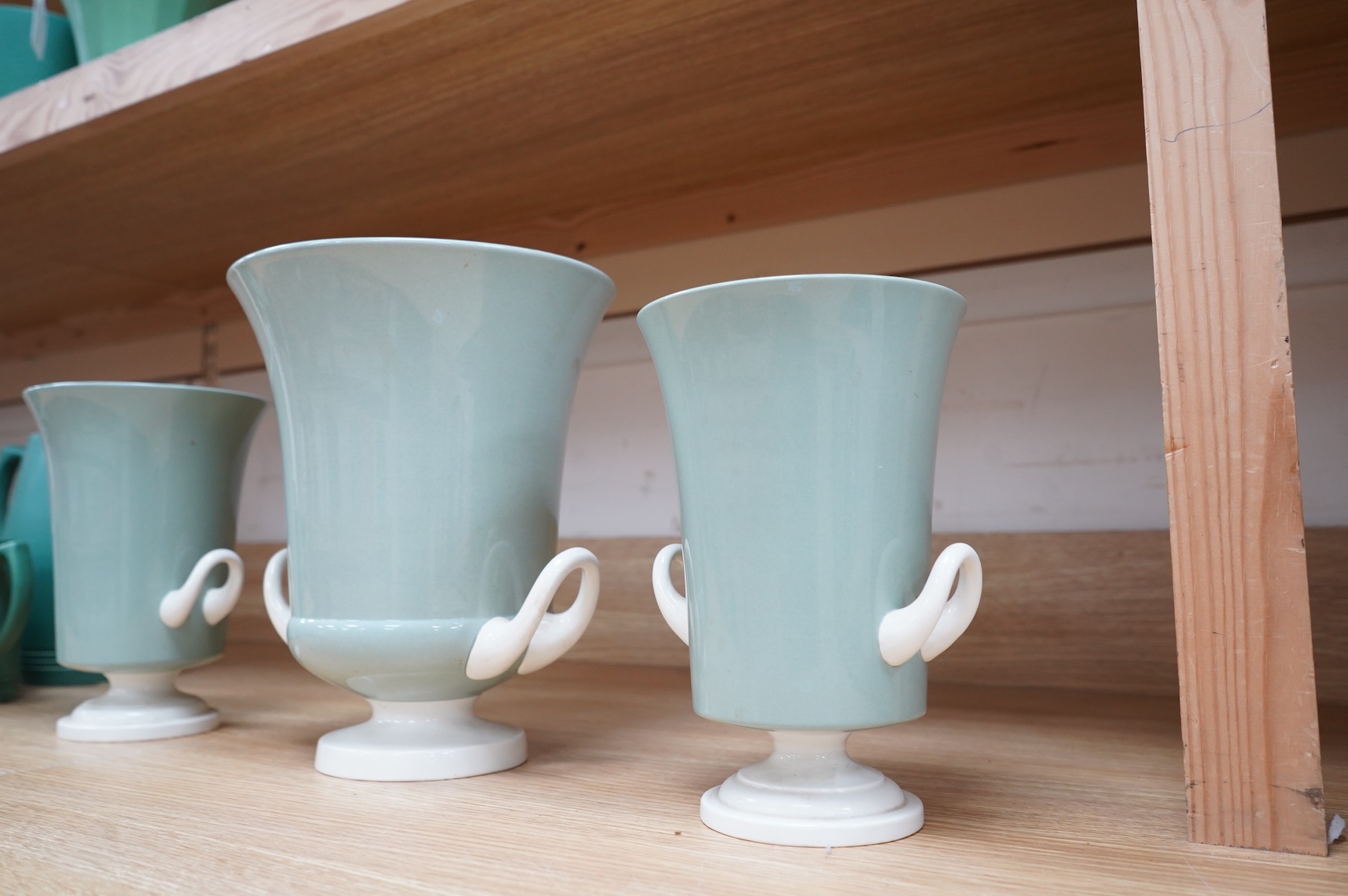 Keith Murray for Wedgwood, a garniture of three graduated twin handled slipware vases, stamped to the bases, largest 25cm high